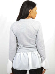 Contrasto Detalle de la camisa del dobladillo Top