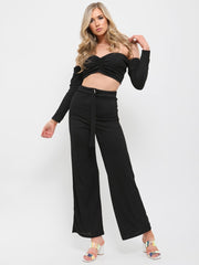 Top de cultivo acanalado y coordenada de pantalones D