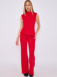 Top de mangas asimétrica de punto alto tejido y pantalón acampanado coordenado - Red