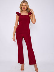 Ruches riemen slinky top- en breedbeen broekcoördin