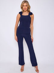 Ruches riemen slinky top- en breedbeen broekcoördin