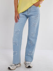 Crucifix geborduurde rechte been denim jeans