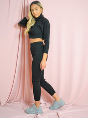 Coordina acanalada de punto de cuello enrollable