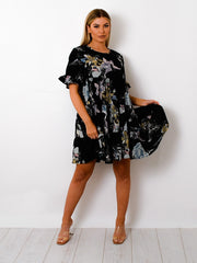 Blumendruck -Schnickschnackstufen -Smock -Kleid