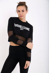 Oversized 'TROUBLESOME' Fishnet Stripe Crop Top