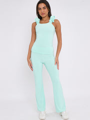 Ruches riemen slinky top- en breedbeen broekcoördin