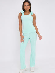 Ruches riemen slinky top- en breedbeen broekcoördin