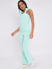 Ruches riemen slinky top- en breedbeen broekcoördin