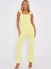 Ruches riemen slinky top- en breedbeen broekcoördin