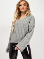 Schalten Sie die Hülle mit V-Ausschnitt-Strickpullover auf