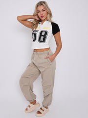 Sieht gut aus, Grafik halb Zip Crop Top