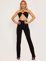 Top de cultivo de halter cruzado y pantalón coorden