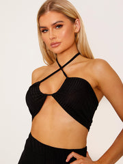 Top de cultivo de halter cruzado y pantalón coorden