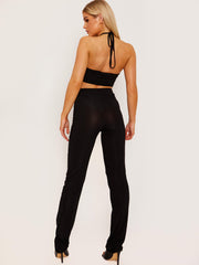 Top de cultivo de halter cruzado y pantalón coorden