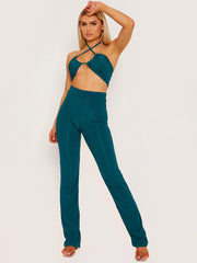 Top de cultivo de halter cruzado y pantalón coorden