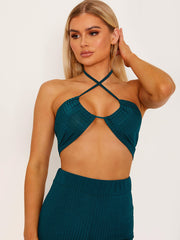 Top de cultivo de halter cruzado y pantalón coorden