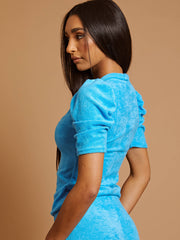 Handdoekstof met pieptophuls en de coörde van de flare broek